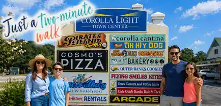 Family standing in front of the Corolla Light Town Center sign in Corolla, North Carolina, highlighting nearby shops, dining, and family-friendly attractions just a short walk from Sonoma’s Hideaway.