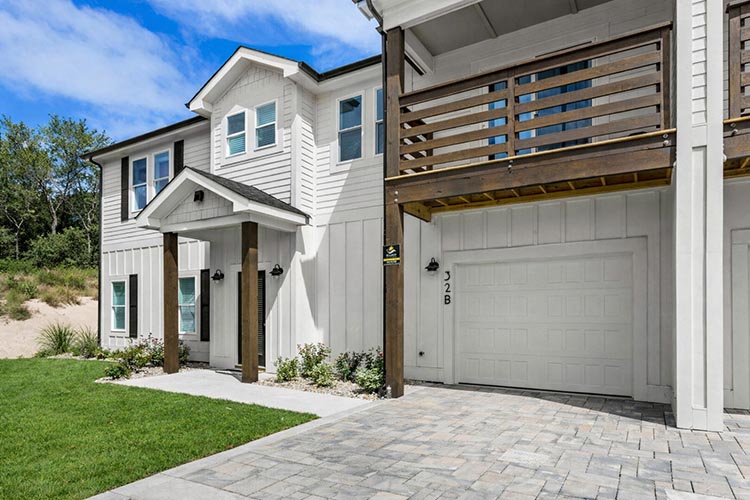 Front exterior of Sonoma's Hideaway, a modern Corolla NC vacation rental in the Outer Banks with garage, balcony, and coastal design
