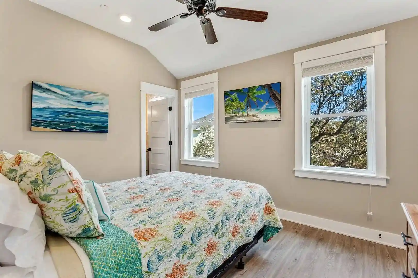 Third bedroom at Sonoma’s Hideaway in Corolla Outer Banks with queen bed, private bathroom, and windows with beach facing views