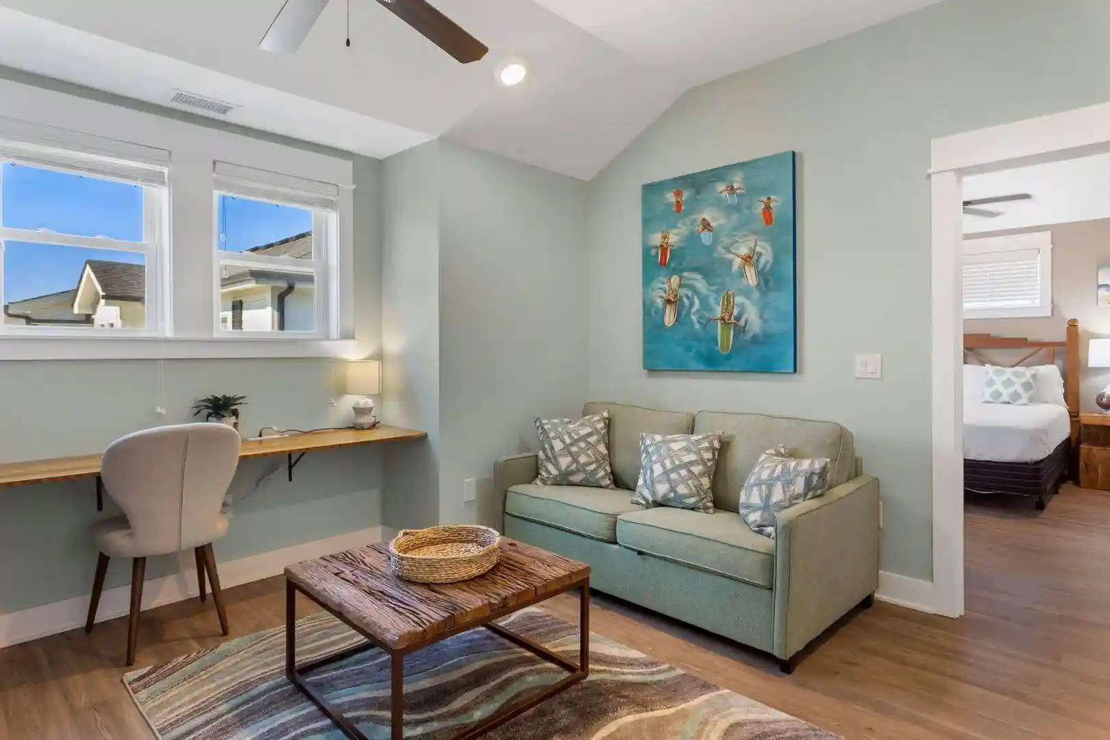 Upstairs landing at Sonoma’s Hideaway in Corolla Outer Banks with sleeper sofa, TV, gaming area, and built-in desk workspace for remote work