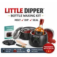 Little Dipper Bottle Waxing Kit with wax warmer, sealing wax pellets, stirring sticks, and a wax-sealed whiskey bottle.