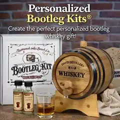 Personalized Bootleg Kits® featuring custom engraved oak whiskey barrel, bootleg kit box, and whiskey essence bottles on rustic bar background.