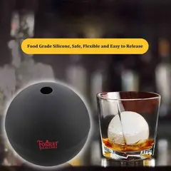 Foghat food-grade silicone ice ball mold with slow-melting ice sphere in whiskey glass