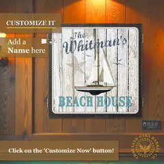 Personalized beach house dartboard cabinet with custom family name option, nautical sailboat design, and coastal wood finish for beach home game rooms.