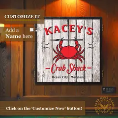 Custom Crab Shack dartboard cabinet mounted on wood wall with personalized name option and red crab nautical design, inspired by Ocean City Maryland beach decor.
