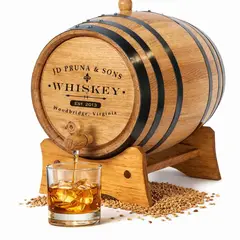 Personalized classic whiskey mini oak aging barrel made from American white oak with custom engraved name and spigot pouring bourbon.