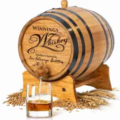 Personalized mini oak whiskey aging barrel made from American white oak with rye and wheat grains and whiskey pouring into glass