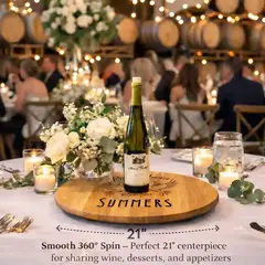 21 inch wine barrel head lazy susan centerpiece with wine bottle and candles displayed on a rustic winery wedding table.