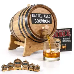 Small chalkboard aging barrel labeled “Bourbon” with date, pouring whiskey into a glass, accompanied by The Bootlegger’s Bible: A Spiritual Guide to Aging.
