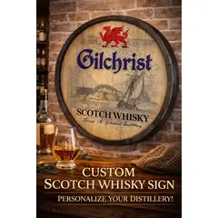 Custom Gilchrist Scotch Whisky quarter barrel sign featuring red Welsh dragon crest and vintage sailing ship artwork, personalized 20–21 inch round handmade wooden barrel head wall decor displayed in home bar with whisky glass and bottle.