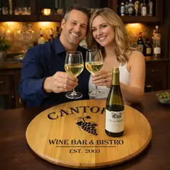 Couple enjoying wine at home bar with custom engraved wine barrel lazy susan centerpiece