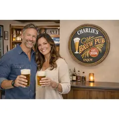 Personalized Charlie’s Brew Pub barrel head sign displayed above home bar with couple holding beer glasses.