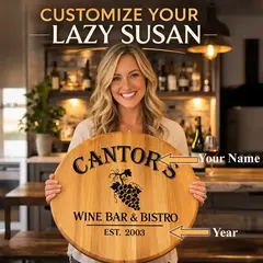 Woman holding personalized wine barrel head lazy susan custom engraved with family name