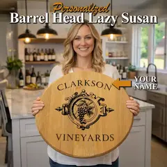 Woman holding personalized barrel head lazy susan with custom engraved vineyard design in bright kitchen wine bar