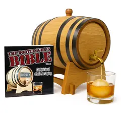 Oak whiskey aging barrel with brass spigot pouring bourbon next to Bootlegger’s Bible home aging kit