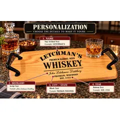 Personalized whiskey barrel head serving tray showing custom engraving options for name, distillery, city, state, and year with black wrought iron handles.