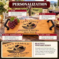 Custom engraved oak barrel head wine serving tray measuring 21 inches long by 11 inches wide, featuring heavy-duty black wrought iron handles, natural oak grain, and personalized winery design.