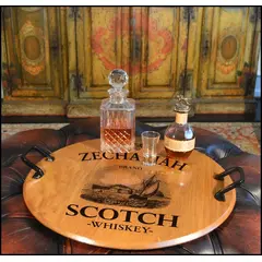 21-inch authentic oak barrel head serving tray with wrought iron handles displaying whiskey decanter and glasses in a rustic bar setting.