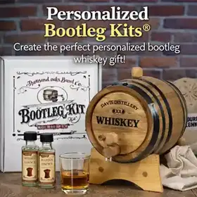 Personalized Bootleg Kits® featuring custom engraved oak whiskey barrel, bootleg kit box, and whiskey essence bottles on rustic bar background.
