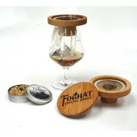 Foghat Cocktail Smoker placed on stemmed whiskey glass demonstrating universal glass compatibility.