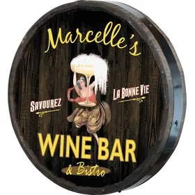 Handmade quarter barrel wine bar sign with Marcelle’s Wine Bar & Bistro design on wood barrel end side view