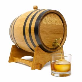 Small oak aging barrel with black metal hoops on a wooden stand, pouring whiskey from a brass spigot into a glass with a large ice sphere.