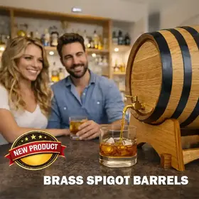 New brass spigot oak aging barrel pouring whiskey into a rocks glass in a bright home bar with a smiling couple in the background.