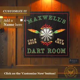 Close-up lifestyle image of a custom dartboard cabinet reading “Maxwell’s Dart Room,” showing a family playing darts in a home game room setting.