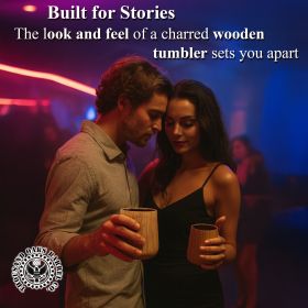 Couple holding Foghat charred wooden whiskey tumblers in a nightclub, highlighting the stylish handcrafted design and premium whiskey-drinking experience.