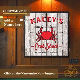 Custom Crab Shack dartboard cabinet mounted on wood wall with personalized name option and red crab nautical design, inspired by Ocean City Maryland beach decor.