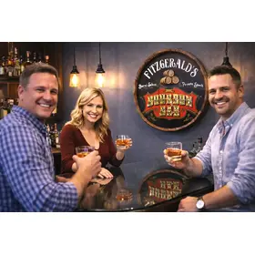 Fitzgerald’s Bourbon Bar handmade quarter barrel sign displayed in home bar with friends enjoying bourbon.