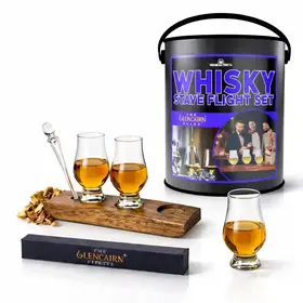 Man Can Whiskey Barrel Flight Set featuring three Glencairn Wee glasses on an authentic Scotch barrel stave, one additional glass off the board, Glencairn pipette, and premium gift can packaging displayed on a clean white background.
