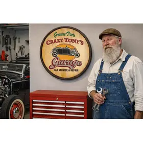 Handmade wooden garage barrel sign displayed in home workshop with mechanic working on classic car restoration.