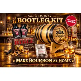 Personalized Bootleg Bourbon Making Kit featuring custom engraved American white oak barrel with working spigot pouring bourbon into glass, bourbon essence packets, and Bootlegger’s Bible guide on bar counter.