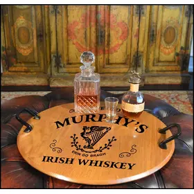 21-inch round authentic oak barrel head serving tray with wrought iron handles displaying Irish whiskey decanter and glass in a rustic bar setting.