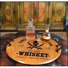 Authentic 21-inch round oak barrel head serving tray with wrought iron handles displaying whiskey decanter and glass in a rustic bar setting. 'Drunken Sailor' Barrel Head Serving Tray