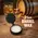 .25oz barrel wax tub in rustic setting beside oak aging barrel and whiskey glass, used for sealing stave seams and preventing spirit evaporation.