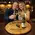 Couple enjoying wine at home bar with custom engraved wine barrel lazy susan centerpiece
