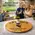 Wine barrel head lazy susan centerpiece on kitchen island with wine glasses and guests entertaining