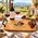 Personalized solid oak winery serving tray featuring four custom engraving options: family name, establishment year, winery or business name, and city/state, with vineyard artwork and black wrought iron handles.