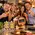 Friends enjoying Old Fashioned cocktails at a home party with the Bootleg Brand™ Barrel-Aged Cocktail Kit, oak aging barrel, Old Fashioned and Manhattan cocktail mixes.