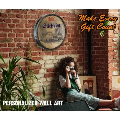 Woman sitting with scotch whiskey quarter barrel sign behind her