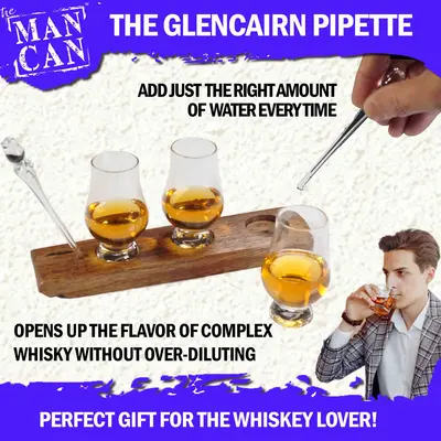 Close-up of Glencairn pipette adding water to whiskey glass on real Scotch barrel stave flight board to enhance aroma and flavor.