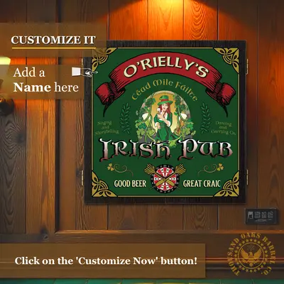 Personalized Irish pub dartboard cabinet mounted on a wood-paneled wall with “O’Rielly’s Irish Pub” design and customization prompt to add a name.