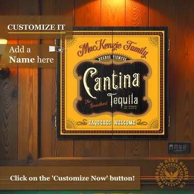 Custom Cantina Tequila dartboard cabinet mounted on wood-paneled wall with “Customize It – Add a Name Here” text overlay and personalized family name displayed on the doors.