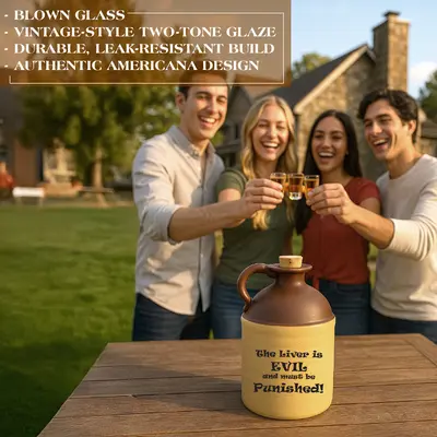 Ceramic moonshine jug with brown top, beige body, cork stopper, and printed text ‘The liver is evil and must be punished,’ displayed on an outdoor wooden table with people holding shot glasses in the background