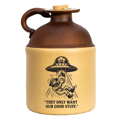 Alien-abduction stoneware moonshine jug featuring a UFO beaming up a moonshiner with the caption “They Only Want Our Good Stuff,” shown against a white background.