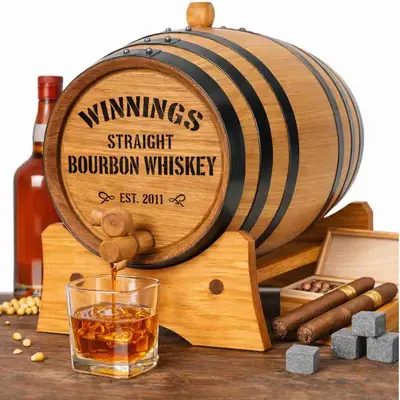 Mini oak bourbon aging barrel on wooden stand with whiskey glass, bottle, cigars, and whiskey stones for home aging and flavor infusion.