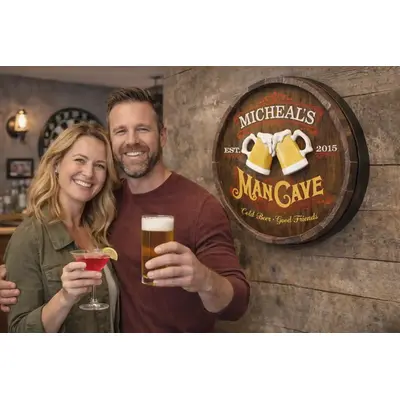 Couple standing beside handmade 20 inch round personalized barrel end man cave sign with raised beer mugs
