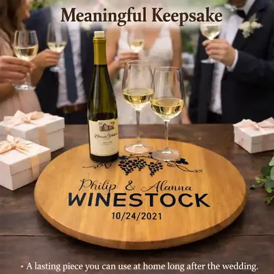 Custom engraved wine barrel lazy susan wedding keepsake centerpiece with wine bottle and glasses on rustic reclaimed barrel head tray.